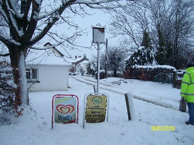 Shebbear village shop signs in snow